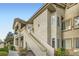 Two-story condo showcasing well-maintained landscaping and a private entrance stairway at 3924 Quiet Pine St # 201, Las Vegas, NV 89108