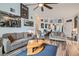 Cozy living room with wood flooring, a ceiling fan, and comfortable seating at 3924 Quiet Pine St # 201, Las Vegas, NV 89108
