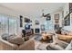 Bright living room with hardwood floors, a fireplace, and wall art at 3924 Quiet Pine St # 201, Las Vegas, NV 89108