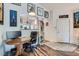Bright office space with a wooden desk, decorative artwork, and easy access to front entrance at 3924 Quiet Pine St # 201, Las Vegas, NV 89108