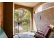 Private balcony with seating area overlooking lush greenery at 3975 N Hualapai Way # 147, Las Vegas, NV 89129