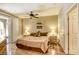 Inviting bedroom with wood floors, ceiling fan, and a comfortable, warm ambiance at 3975 N Hualapai Way # 147, Las Vegas, NV 89129