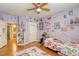 Charming bedroom with unique decor, hardwood floors, and abundant natural light at 3975 N Hualapai Way # 147, Las Vegas, NV 89129