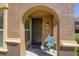 Inviting front entryway with arched doorway at 3975 N Hualapai Way # 147, Las Vegas, NV 89129