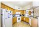 Practical kitchen with sleek appliances and ample storage and view to dining area at 3975 N Hualapai Way # 147, Las Vegas, NV 89129