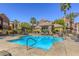 Community pool area with lounge chairs and well-maintained landscaping at 3975 N Hualapai Way # 147, Las Vegas, NV 89129