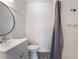 Stylish bathroom includes a shower-tub combination and updated fixtures at 4498 Via San Rafael, Las Vegas, NV 89103