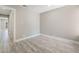 Cozy bedroom with neutral walls and modern vinyl plank flooring for comfort and style at 4498 Via San Rafael, Las Vegas, NV 89103
