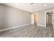 Large bedroom features wood-style floors, light gray walls, recessed lighting and doors to the hall and bathroom at 4498 Via San Rafael, Las Vegas, NV 89103