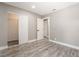 Bright bedroom featuring modern gray laminate flooring, closet and neutral paint at 4498 Via San Rafael, Las Vegas, NV 89103