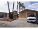 Charming single-story home with a two-car garage, a driveway and desert landscaping at 4498 Via San Rafael, Las Vegas, NV 89103