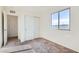 Bedroom featuring a window and plush carpeting, a sliding closet door, and an entrance to another room at 4539 Cotton Quail Ave, Las Vegas, NV 89115