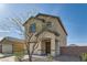 View of the house with an attached garage, featuring desert landscaping and an inviting covered entrance at 4539 Cotton Quail Ave, Las Vegas, NV 89115