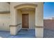 Close-up of the front entrance showcasing a charming covered porch and a modern security system at 4539 Cotton Quail Ave, Las Vegas, NV 89115