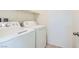 Functional laundry room showcasing white washer and dryer appliances for convenient home chores at 4539 Cotton Quail Ave, Las Vegas, NV 89115