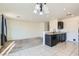Open-concept living space with a combined kitchen, dining, and living area filled with natural light at 4539 Cotton Quail Ave, Las Vegas, NV 89115