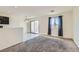 Inviting living area featuring plush carpeting, a large window, and a combined dining space at 4539 Cotton Quail Ave, Las Vegas, NV 89115