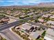 Overhead view of home featuring covered patio, landscaping, and adjacent neighborhood at 4818 Al Carrison St, Las Vegas, NV 89149