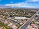 Expansive aerial view showcasing a neighborhood home's proximity to Painted Desert Golf Club at 4818 Al Carrison St, Las Vegas, NV 89149