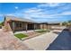 Spacious backyard shows bocce court, turf, decorative brick and a covered pergola at 4818 Al Carrison St, Las Vegas, NV 89149