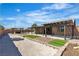 Landscaped backyard features a pergola covered patio, bocce court, and ample space for recreation at 4818 Al Carrison St, Las Vegas, NV 89149