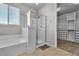 Modern bathroom with a glass-enclosed shower and a built-in closet at 4818 Al Carrison St, Las Vegas, NV 89149