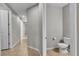 Simple bathroom features a toilet, neutral paint and tile floors at 4818 Al Carrison St, Las Vegas, NV 89149