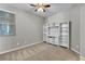 Comfortable bedroom with ceiling fan and a media center with lots of storage space at 4818 Al Carrison St, Las Vegas, NV 89149