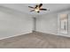 Neutral bedroom with a ceiling fan and carpet at 4818 Al Carrison St, Las Vegas, NV 89149