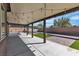 Large covered patio area featuring concrete and brick flooring, as well as string lights for evening enjoyment at 4818 Al Carrison St, Las Vegas, NV 89149