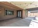 Inviting covered patio with a double door entrance and string lights, perfect for outdoor gatherings at 4818 Al Carrison St, Las Vegas, NV 89149