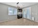 Dining room with tile floors, a modern light fixture and access to the backyard at 4818 Al Carrison St, Las Vegas, NV 89149