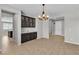 Open dining room featuring a built-in hutch and elegant chandelier lighting at 4818 Al Carrison St, Las Vegas, NV 89149