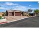 Charming two-story home featuring a three-car garage, nicely landscaped yard, and inviting curb appeal at 4818 Al Carrison St, Las Vegas, NV 89149