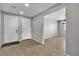 Neat foyer with neutral walls and tile flooring that opens to dining area and entryway at 4818 Al Carrison St, Las Vegas, NV 89149