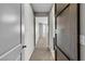 Hallway view, showcasing an open floor plan with light gray walls and carpet at 4818 Al Carrison St, Las Vegas, NV 89149