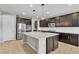 Spacious kitchen featuring stainless appliances, a large island, and granite countertops at 4818 Al Carrison St, Las Vegas, NV 89149