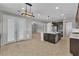Open concept kitchen with a large island, stainless appliances and modern lighting at 4818 Al Carrison St, Las Vegas, NV 89149