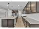Bright kitchen with a large island, stainless appliances and granite countertops at 4818 Al Carrison St, Las Vegas, NV 89149