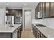 Modern kitchen featuring stainless appliances, granite counters and white backsplash at 4818 Al Carrison St, Las Vegas, NV 89149