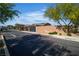 Street view of a gated home within a secure community, highlighting privacy and curb appeal at 4818 Al Carrison St, Las Vegas, NV 89149