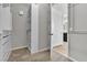 Well-organized walk-in closet adjacent to bathroom features custom shelving for ample storage solutions at 4818 Al Carrison St, Las Vegas, NV 89149