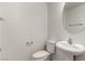 Clean half bathroom features pedestal sink, toilet, and neutral wall color at 519 Brinkburn Point Ave, Las Vegas, NV 89178