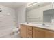 Bright bathroom featuring a double sink vanity and a shower-tub combo at 519 Brinkburn Point Ave, Las Vegas, NV 89178
