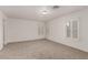 Unfurnished bedroom with shuttered windows, plush carpet, and neutral paint at 519 Brinkburn Point Ave, Las Vegas, NV 89178