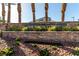 The Huntington Community entrance sign is surrounded by desert landscaping and palm trees at 519 Brinkburn Point Ave, Las Vegas, NV 89178