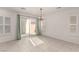 Dining area with tile floors, plantation shutters, and sliding glass doors to backyard at 519 Brinkburn Point Ave, Las Vegas, NV 89178