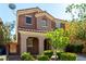 Two-story home with a tiled roof, desert landscaping, and a well-maintained front yard at 519 Brinkburn Point Ave, Las Vegas, NV 89178