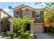 Well-maintained two-story house with desert landscaping, a tile roof and an attached one-car garage at 519 Brinkburn Point Ave, Las Vegas, NV 89178