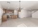 Spacious kitchen with an island, tile floors, and stainless steel appliances at 519 Brinkburn Point Ave, Las Vegas, NV 89178